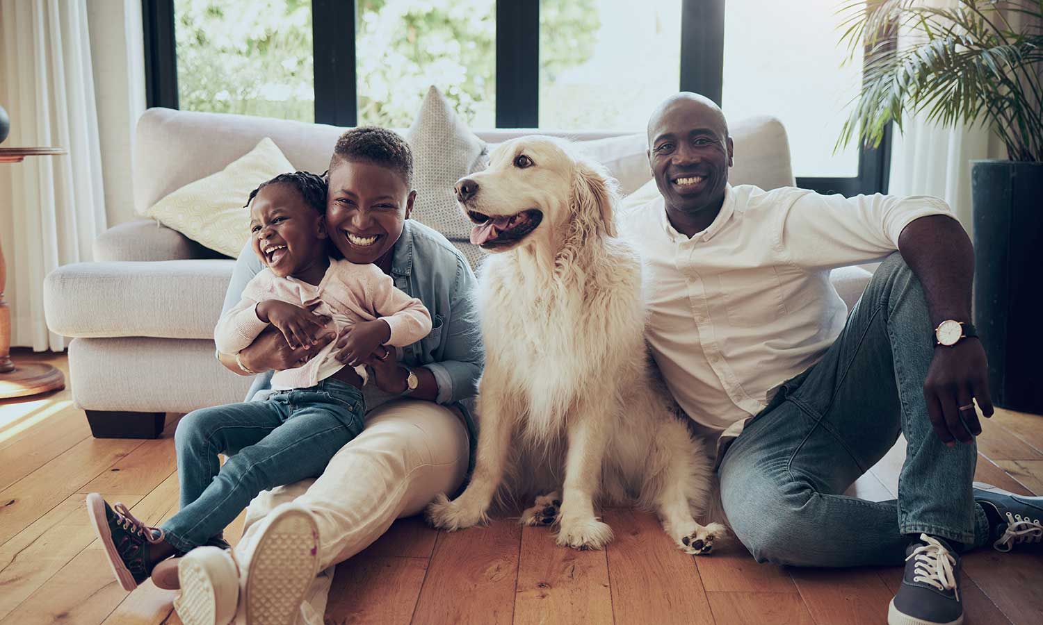 A family with their golden retriever